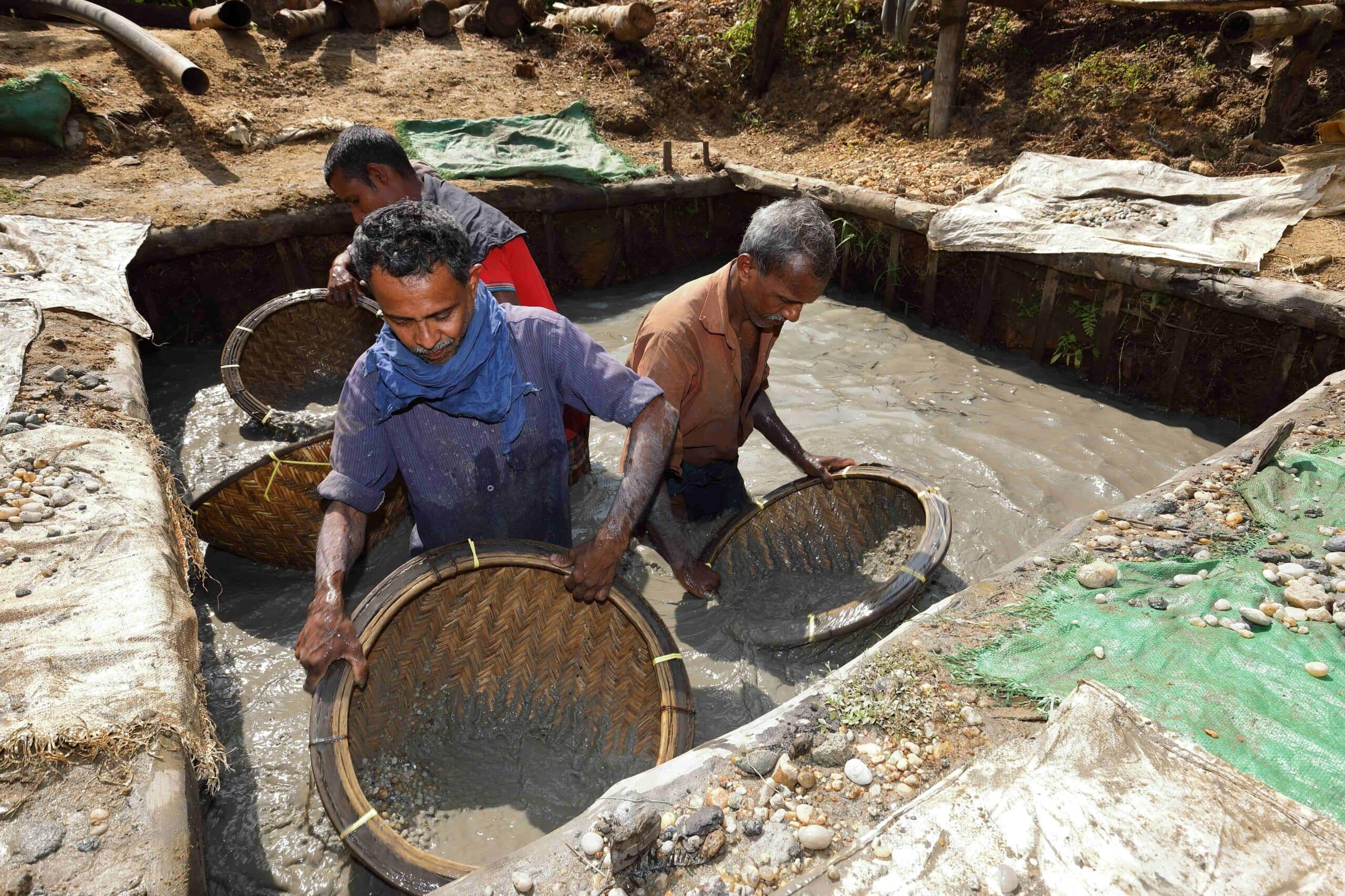 Sri Lankan miners practicing ethical and sustainable gemstone extraction methods.